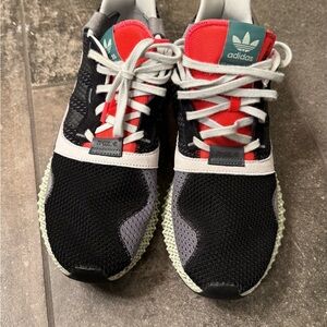Adidas Black and Red Athletic Shoes with White and Green Accents